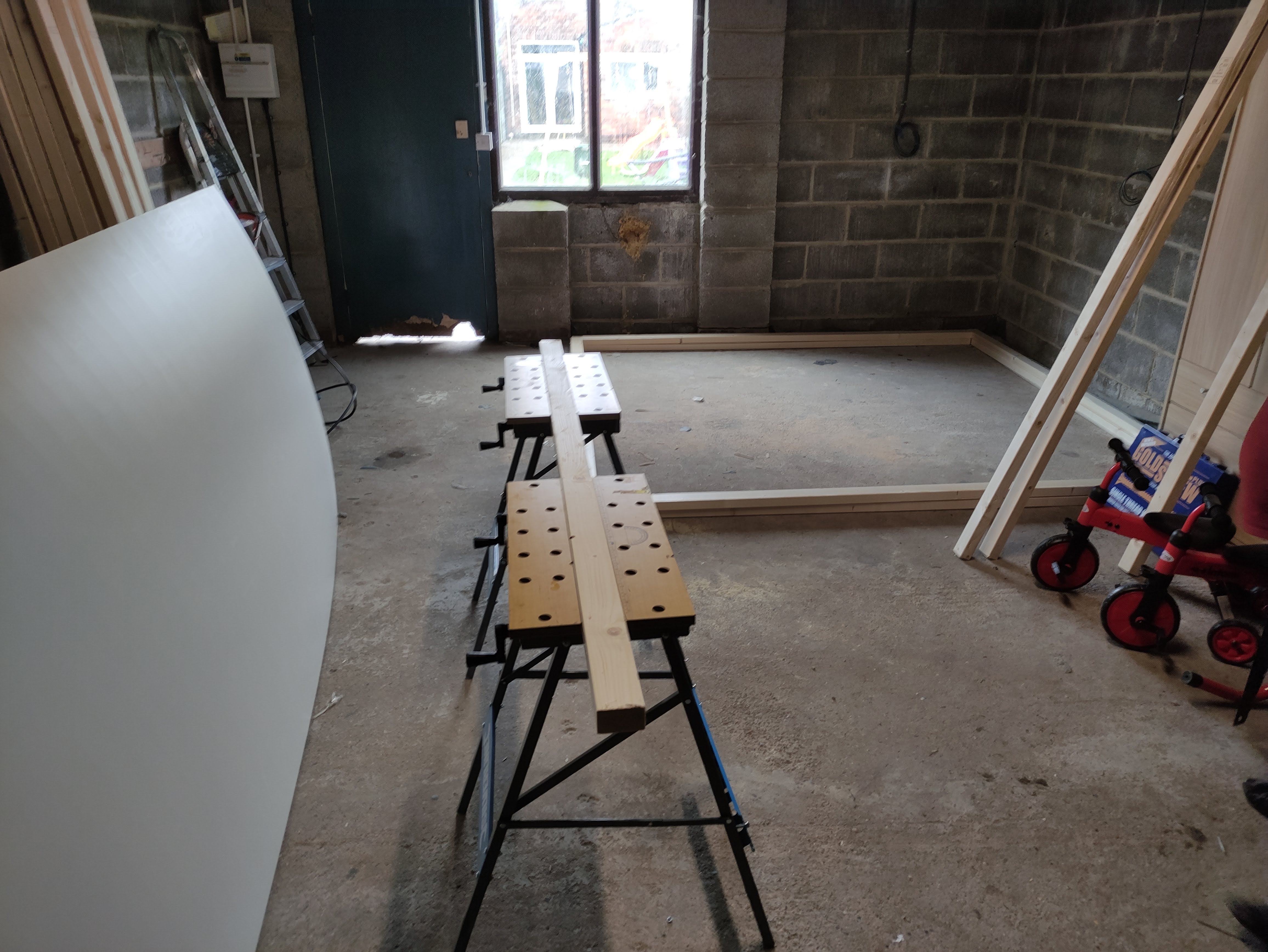 Work benches with wood clamped ready for sawing